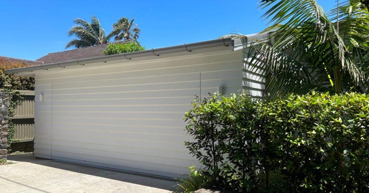 White Timber Garage Door with trees